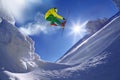 Skier jumping against blue sky from the rock