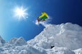 Skier jumping against blue sky from the rock Royalty Free Stock Photo