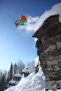 Skier jumping against blue sky from the rock Royalty Free Stock Photo