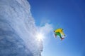 Skier jumping against blue sky from the rock Royalty Free Stock Photo