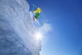 Skier jumping against blue sky from the rock Royalty Free Stock Photo