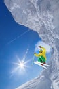 Skier jumping against blue sky from the rock Royalty Free Stock Photo