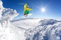 Skier jumping against blue sky from the rock Royalty Free Stock Photo