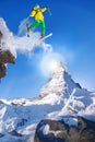 Skier jumping against Matterhorn peak in Switzerland. Royalty Free Stock Photo