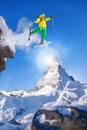 Skier jumping against Matterhorn peak in Switzerland. Royalty Free Stock Photo