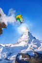 Skier jumping against Matterhorn peak in Switzerland. Royalty Free Stock Photo
