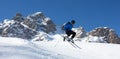 Skier jumping in front of rock mountains Meribel sun snowy mountain landscape France alpes 3 vallees Royalty Free Stock Photo