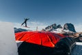 Skier jumping on kicker, balloon landing, Val di Fassa Dolomiti snow park