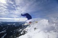 Skier Jumping On Mountain Top Hitting The Slopes