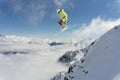 Skier jumps in the mountains. Mountain ski, winter extreme sport.