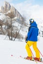 Skier with looking at mountain landscape