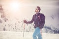 Skier man detail with sunglasses. exploring snowy land walking and skiing with alpine ski. Europe Alps. Winter sunny day