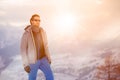 Skier man detail wearing anorak jacket with sunglasses portrait. exploring snowy land walking and skiing with alpine ski