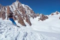 Skier man skiing on glacier or snowy slope with fresh powder. Europe Alps Mont Blanc massif mount. Winter sunny day Royalty Free Stock Photo