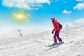 Skier in mountains, prepared piste and sunny day Royalty Free Stock Photo