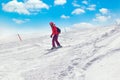 Skier in mountains, prepared piste and sunny day Royalty Free Stock Photo