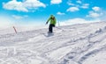 Skier in mountains, prepared piste and sunny day Royalty Free Stock Photo