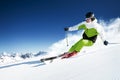 Skier in mountains, prepared piste and sunny day Royalty Free Stock Photo