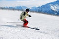 Skier moving down a ski track Royalty Free Stock Photo