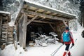 Skier near the garage of the modern snow plough in Mummelsee