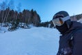 Skier next to the ski slopes at sunset on a sunny day in the high mountains, Grandvalira, Pyrenees, Andorra. Royalty Free Stock Photo