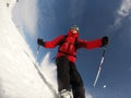 Skier performs a high speed turn on a ski slope. Royalty Free Stock Photo