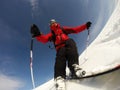 Skier performs a high speed turn on a ski slope. Royalty Free Stock Photo