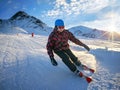 Skier on piste in high mountains with beautiful sky on sunny day Royalty Free Stock Photo