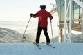 Skier preparing for a downhill ride from the top of a mountain Royalty Free Stock Photo