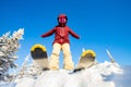 Skier is preparing for jump, lower angle of ski, blue sky winter forest Royalty Free Stock Photo