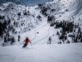 Skier riding in snow in piste downhill in the Italien Alps