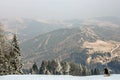 The skier is rolling down from the top of the snow-capped hill on the alpine skiing. Alps, ski resorrt Semmering, Austria. Beautif