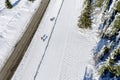 Skier running on the track. Snow white field. Aerial