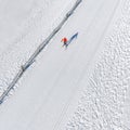 Skier running on the track. Snow white field. Aerial Royalty Free Stock Photo