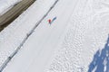 Skier running on the track. Snow white field. Aerial