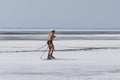 Skier shirtless runs on the frozen ice of the Ob reservoir