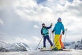 Skier showing friends the mountain tops