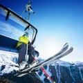 Skier siting on ski-lift - lift in mountains Royalty Free Stock Photo