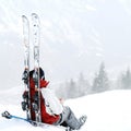 Skier sitting alone. Conceptual image