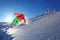 Skier skiing downhill in high mountains Royalty Free Stock Photo