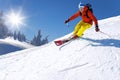 Skier skiing downhill in high mountains against blue sky Royalty Free Stock Photo