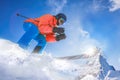 Skier skiing downhill in high mountains against Matterhorn peak in Swiss Alps Royalty Free Stock Photo