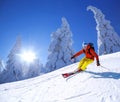 Skier skiing downhill in high mountains against sunset Royalty Free Stock Photo