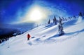 Skier skiing downhill in high mountains against sunset Royalty Free Stock Photo