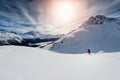 Skier skiing downhill in high mountains against sunset Royalty Free Stock Photo