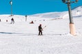 Skier skiing downhill in high mountains Ski slopes and Ski lifts. Royalty Free Stock Photo