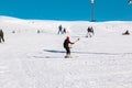 Skier skiing downhill in high mountains Ski slopes and Ski lifts. Royalty Free Stock Photo