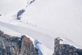 Skier skiing with helmet alone on the ski slope towards Matterhorn mountain on a beautiful sunny day in Switzerland Royalty Free Stock Photo