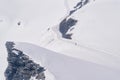 Skier skiing with helmet alone on the ski slope towards Matterhorn mountain on a beautiful sunny day in Switzerland Royalty Free Stock Photo