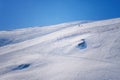 Skier skiing with helmet alone on the ski slope towards Matterhorn mountain on a beautiful sunny day in Switzerland Royalty Free Stock Photo